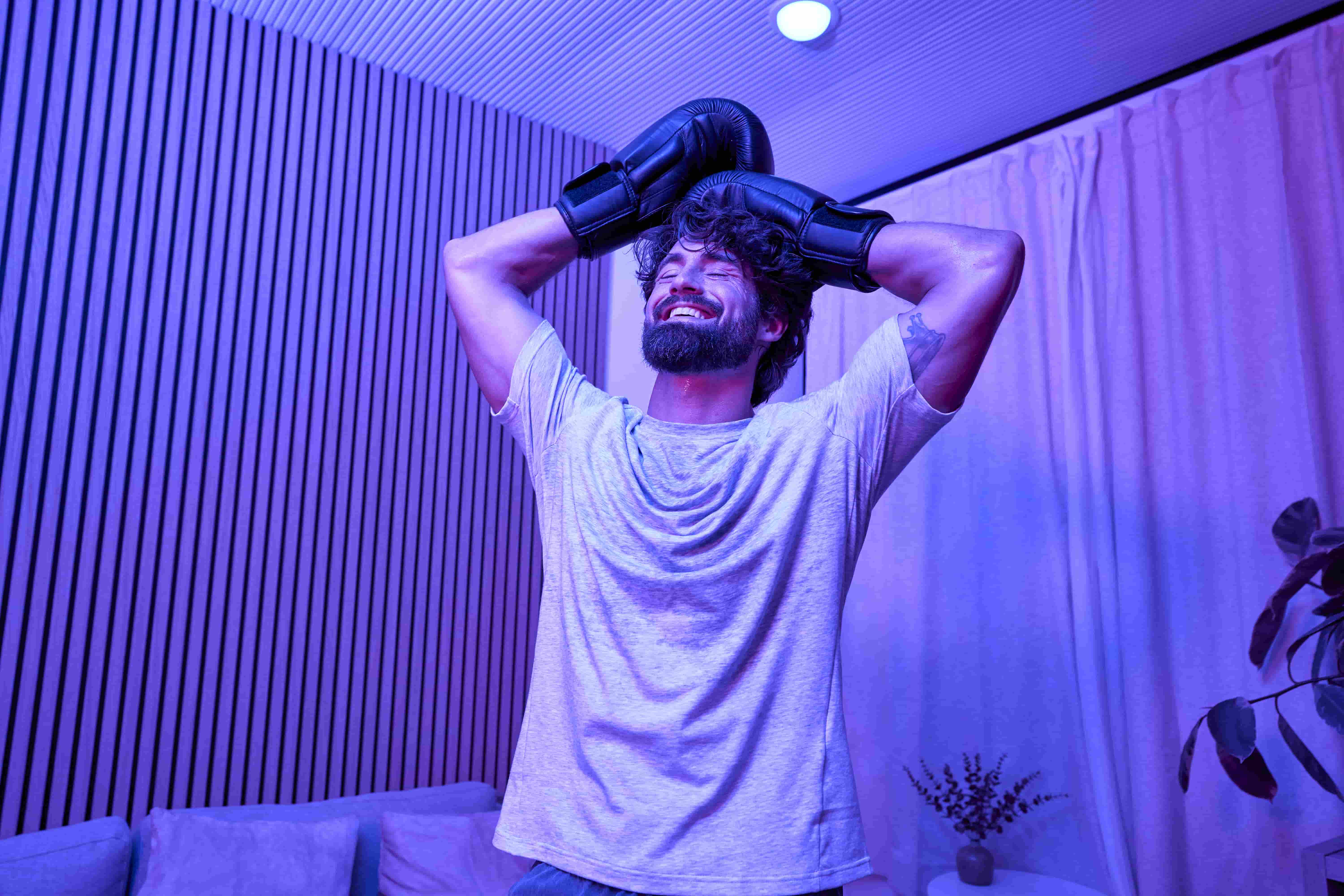 Men showing happiness and relief after boxing workout from home